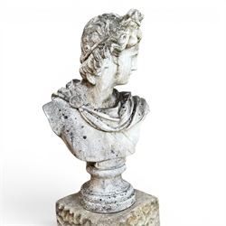 Roman Neoclassical style cast stone bust, weathered finish, raised on textured stone plinth of tapering form