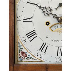 William Gostling of Diss  (Norfolk)-  Late 18th century 8-day oak longcase clock c1780-90, break arch top with scalloped cresting and three brass finials, glazed break arch hood door flanked by turned pilasters with brass capitals, trunk with a long trunk door and rounded top on a square plinth with an applied and shaped skirting, early painted Wilson of Birmingham dial with Roman numerals and five minute Arabic's, matching steel hands and second pointer, arched square ended calendar aperture with date disc behind, floral spandrels within gesso borders and a painted rocking automaton representing Mercury to the break arch, dial pinned via a false plate to a weight driven rack striking movement with a recoil anchor escapement, striking the hours on a cast bell. With pendulum weights and key. 
William Gostling (II) is recorded as working in Diss from 1774 to 1797, succeeded by widow Anne and son George . The dial of this clock is illustrated and discussed in detail in M.F. Tennants book 