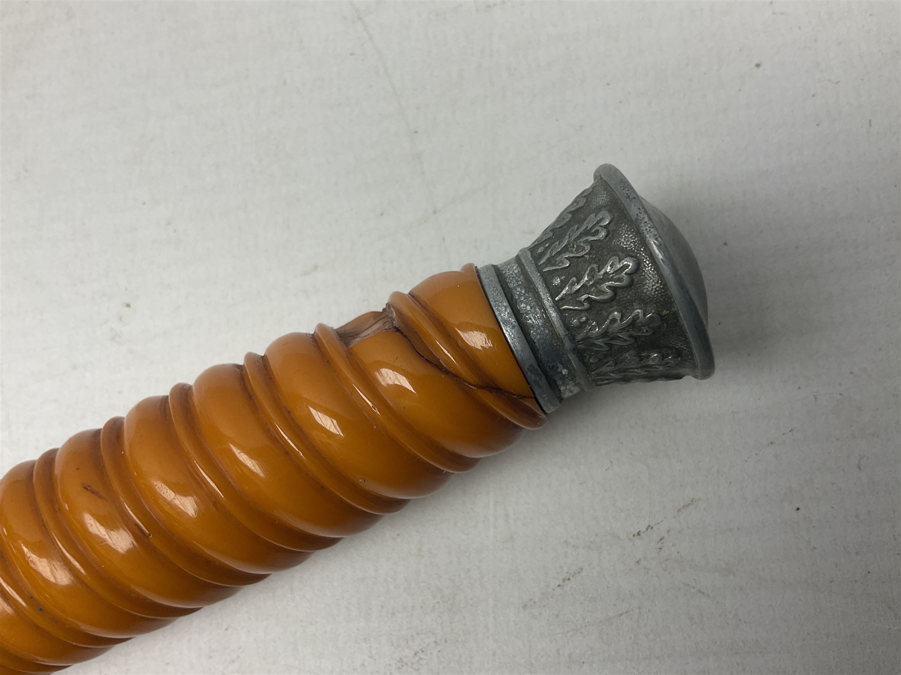 Late WW2 German Army Officers dress dagger, with unmarked 25cm double edged steel blade, orange celluloid grip, pommel and ferrule with oakleaves relief and cross guard with eagle; in original beaded scabbard with two hanging rings L39.5cm overall