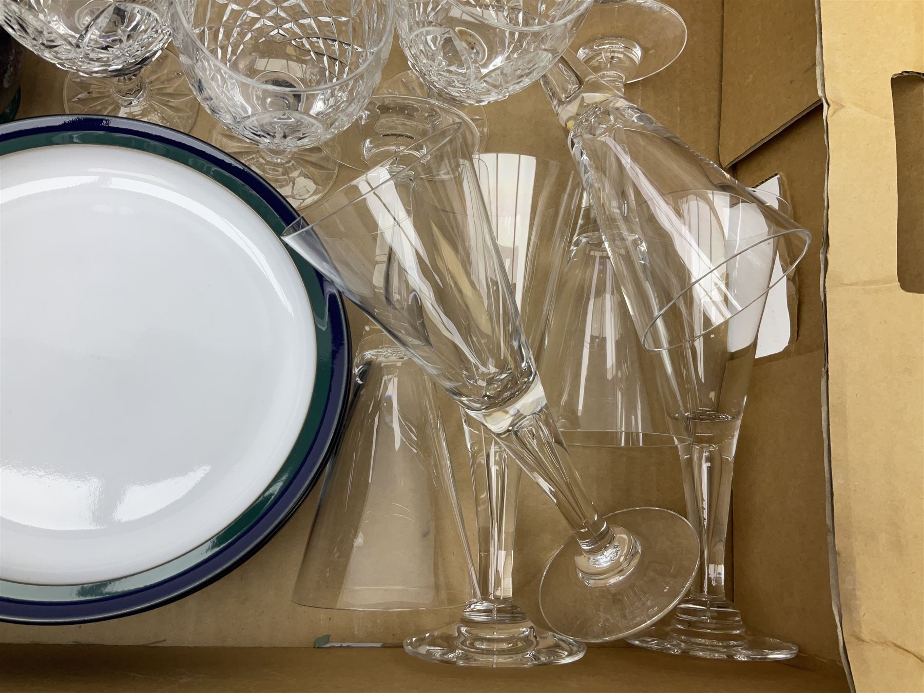 set of six Dartington champagne glasses, with an internal elongated tear in the stem, together with a set of six wine glasses and Denby regatta pattern tea wares comprising of milk jug, eight dessert plates, nine tea cups and eight saucers 