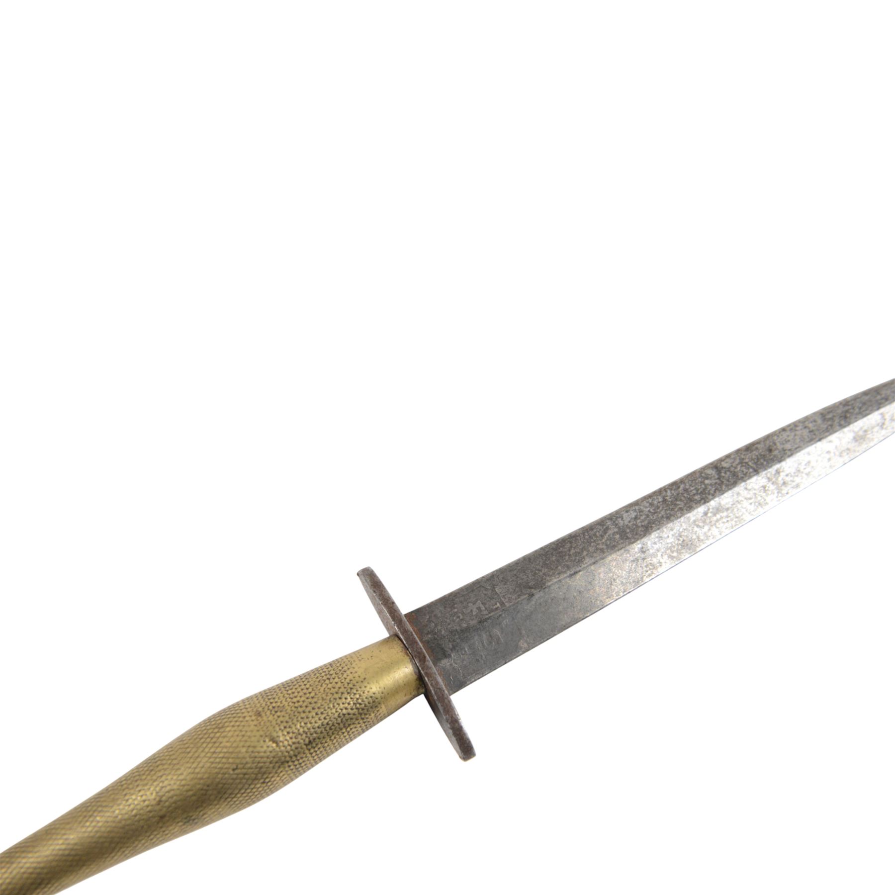 Fairbairn Sykes Fighting Knife, the 17cm double edged blade etched to the ricasso 'F-S Fighting Knife', brass checkered grip with steel ball pommel nut, overall L29cm