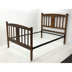 *Early 20th century oak 4' 6'' double bedstead, arched cresting rail above central carved panel and slats