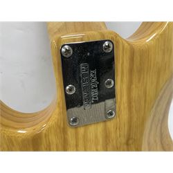 Ernie Ball Music Man Sting Ray 4 string bass guitar, in natural finish with roasted maple neck and tortoiseshell effect scratch guard, serial no 87485, in black Music Man hard case, guitar L114cm