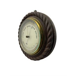 Edwardian - 8-day ships bulkhead clock and an Aneroid barometer.
In matching circular oak cases with carved rope twist bezels.
Clock with a painted metal dial, Roman numerals, minute track and steel spade hands, small seconds hand and platform regulation. Case 9