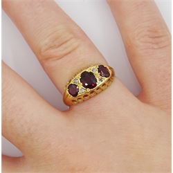Victorian 18ct gold three stone oval garnet ring, with four diamond accents, maker's mark C&S