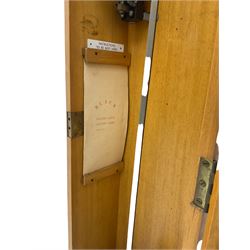 A mid-20th century Gent of Leicester(Blick Electric) Pulsynetic Master Clock in a full length glazed wooden case, with a square white dial with Arabic numerals, minute markers and baton hands, with pendulum and a record card dating from the 1970’s. 
This master clock would have been wired to send time signals to other slave dials in a large building, frequently used in hospitals, schools and factories during the 20th century
With a second electrical movement housed in a glazed square cabinet.


