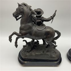 Pair of spelter figural statues of man in period dress, holding rearing horse, upon wooden bases with bun feet, H38cm