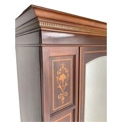 Edwardian inlaid mahogany single wardrobe, projecting cornice over chequerboard frieze, central door with arched bevelled mirror panel, flanked bu inlaid and strung panels with foliate decoration, single drawer to base