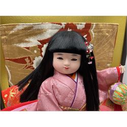 Japanese doll, dressed in traditional Japanese dress, within wooden glazed box, box H40cm