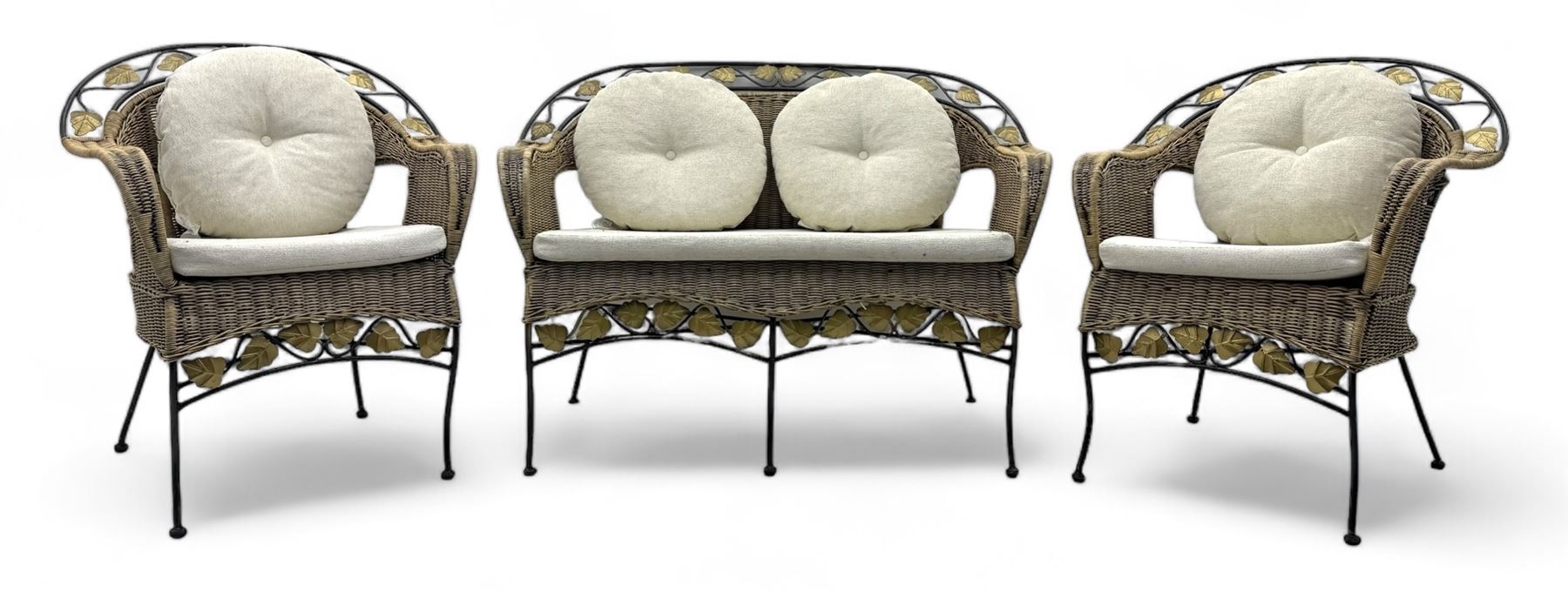 Late 20th century three-piece garden suite, wicker construction and wrought iron frame, decorated with cast metal leaf motifs, cream seat cushions and round back cushions