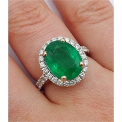  18ct white gold oval emerald and diamond ring, with diamond set shoulders, hallmarked, emerald approx 3.70 carat  
[image code: 4mc]