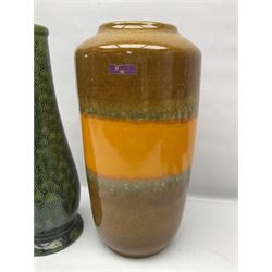 Burmantofts Faience vase, with elongated neck, and concentric circle decoration, in a green lustre glaze, together with a Bretby figure, modelled as a cat with a ball of wool, a Bretby vase, with fluted rim, in orange/red glaze, frog jug and a large West German vase, tallest H38cm