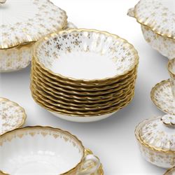 Spode Fleur de Lys tea and dinner service for ten, comprising dinner plates, side plates of graduating sizes, bowls, twin handled soup bowls, three covered dishes, sauce boat and saucer, two serving dishes, open serving dish, teapot, coffee pot, milk jug, covered sucrier, cake plate, vase, jardiniere, cups and saucers