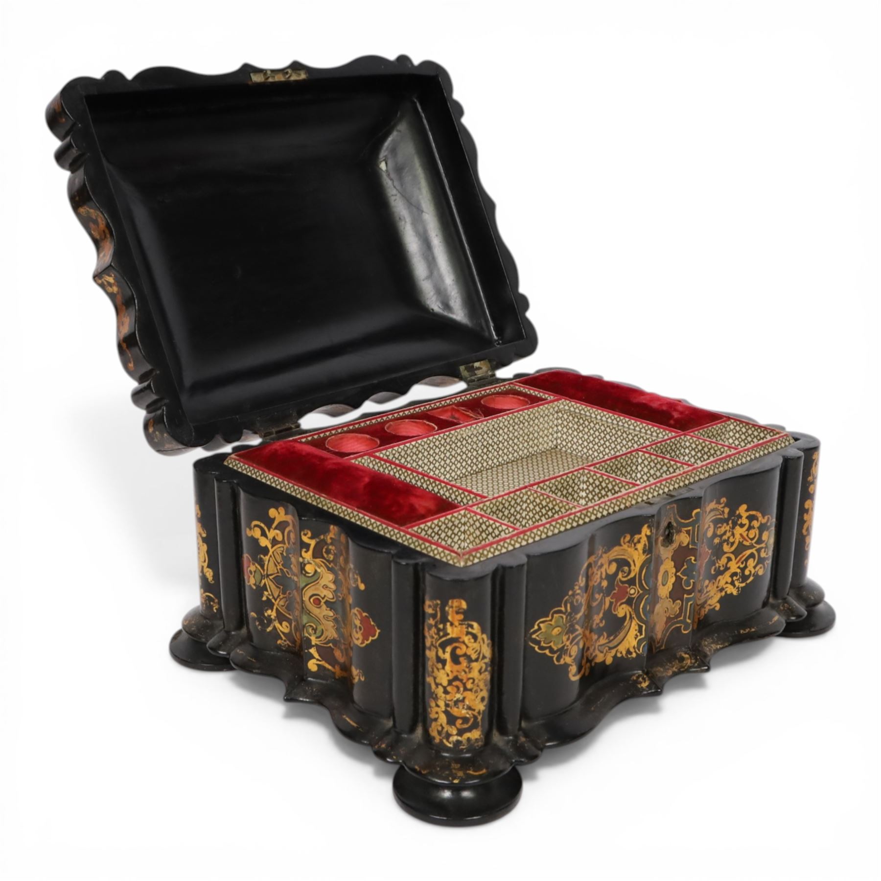 Victorian black lacquered papier-mâché sewing box, of rectangular form with shaped sides, the slightly domed top with inlaid mother of pearl and abalone decoration, the sides with gilt and polychrome painted scrollwork, the hinged cover opening to reveal a fitted interior with lift out tray, H14cm