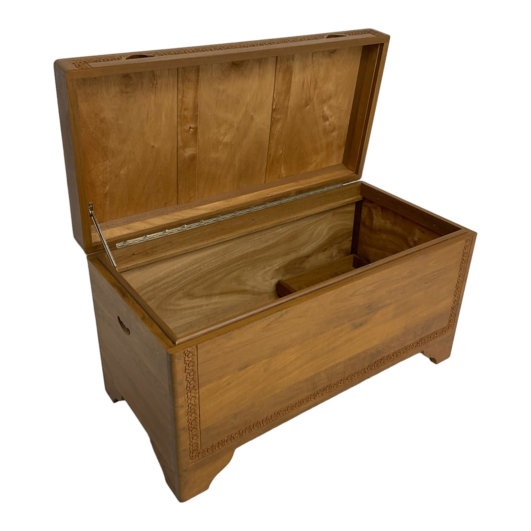 Mid-to-late 20th century Singapore camphor wood blanket chest, the hinged lid and front decorated with flower head carved bands