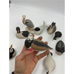 Group of eleven Scottish 'Isle of Arran' bisque porcelain birds, to include Great Northern Diver, Eider, great Crested Greebe, Artic Tern, King Penguin, etc.
