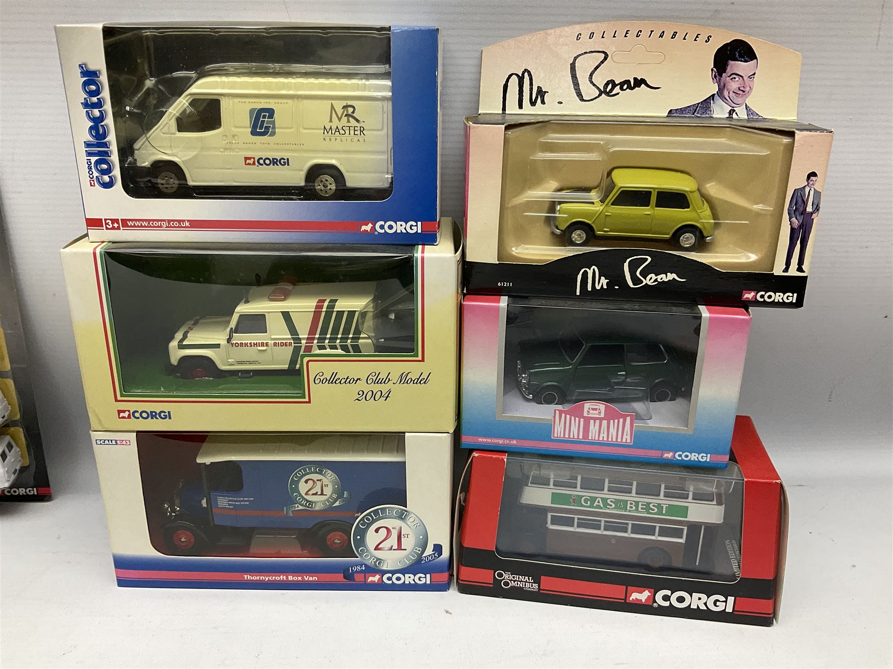 Corgi - eighteen modern die-cast models including racing cars, Land Rovers, Thornycroft Box Van, Ford Transit and Bedford Vans, Minis, Last Routemaster bus, two Trackside DIYCAST sets etc; all boxed (18)
