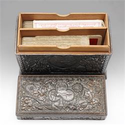 Japanese Meiji period bronze playing card box, decorated with intricate repoussé floral motifs, marked to base, W13cm H10cm