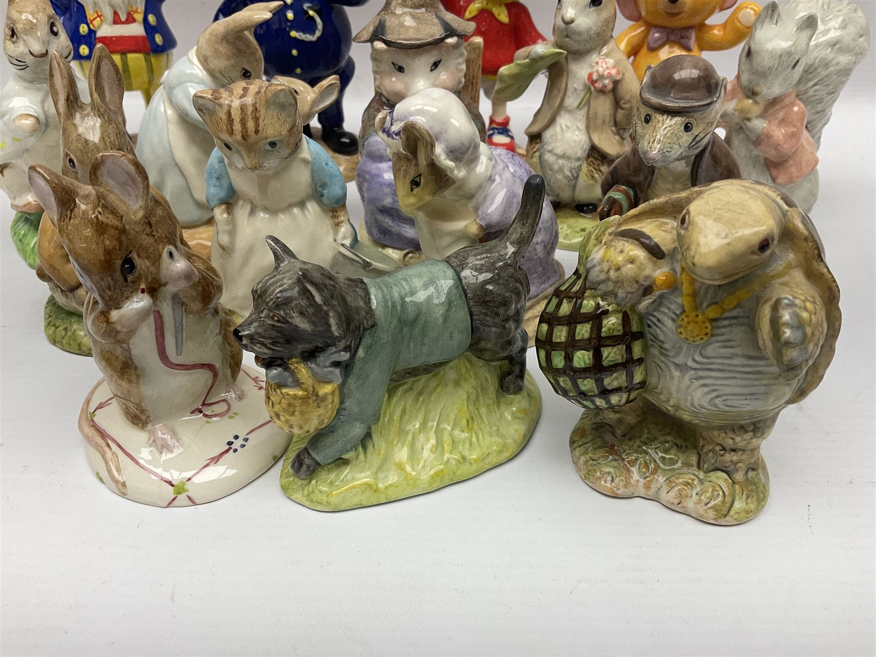 Twelve Royal Albert Beatrix Potter figures, including Mr Alderman Ptolemy, Peter Rabbit and This Pig Had None, etc, some boxed, together with four Royal Worcester Noddy figures, including Big Ears and PC Plod, boxed