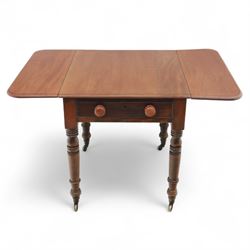 Mahogany drop-leaf Pembroke table circa 1900, with rounded rectangular top and single frieze drawer, raised on turned and tapered supports with brass castors (Extended 128cm)