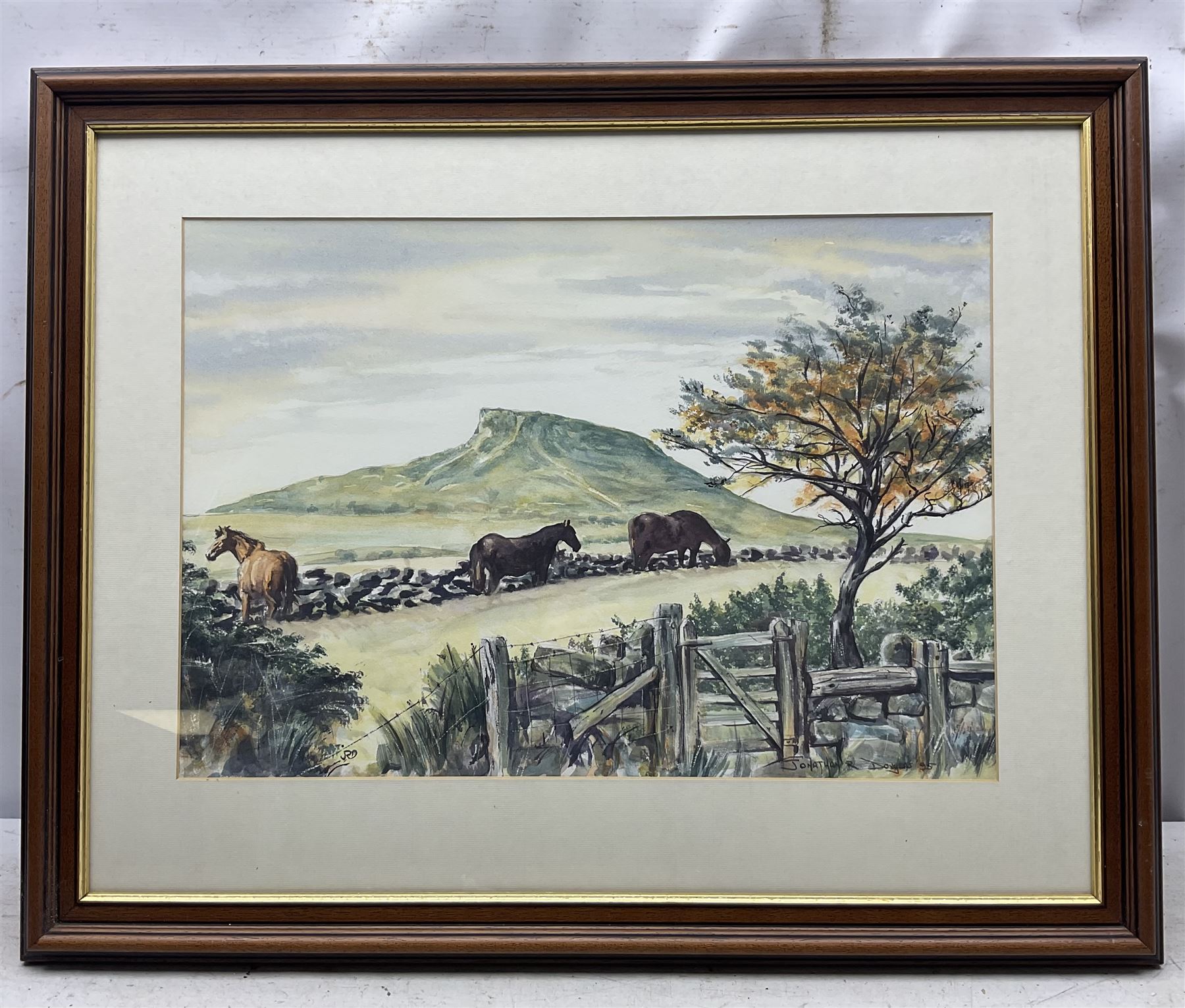 Jonathan R Douglas (Welsh Contemporary): Horses Grazing on a Hilltop, watercolour signed and dated '95, 36cm x 52cm