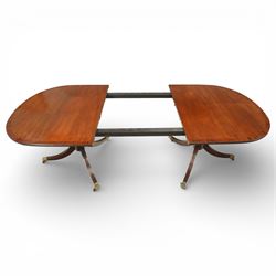 Arthur Brett & Sons - Regency design mahogany extending dining table and eight chairs, the oval top with rounded ends and two extension leaves, raised on twin pedestal supports with swept legs terminating in brass caps and castors, accompanied by a set of eight chairs comprising six single chairs and a pair of carvers, the chairs with curved backs and horizontal splat rails, upholstered seats, sabre legs and scrolling arms to the carvers
(Extends to 252cm)
(Chairs H 86cm, W 52cm)