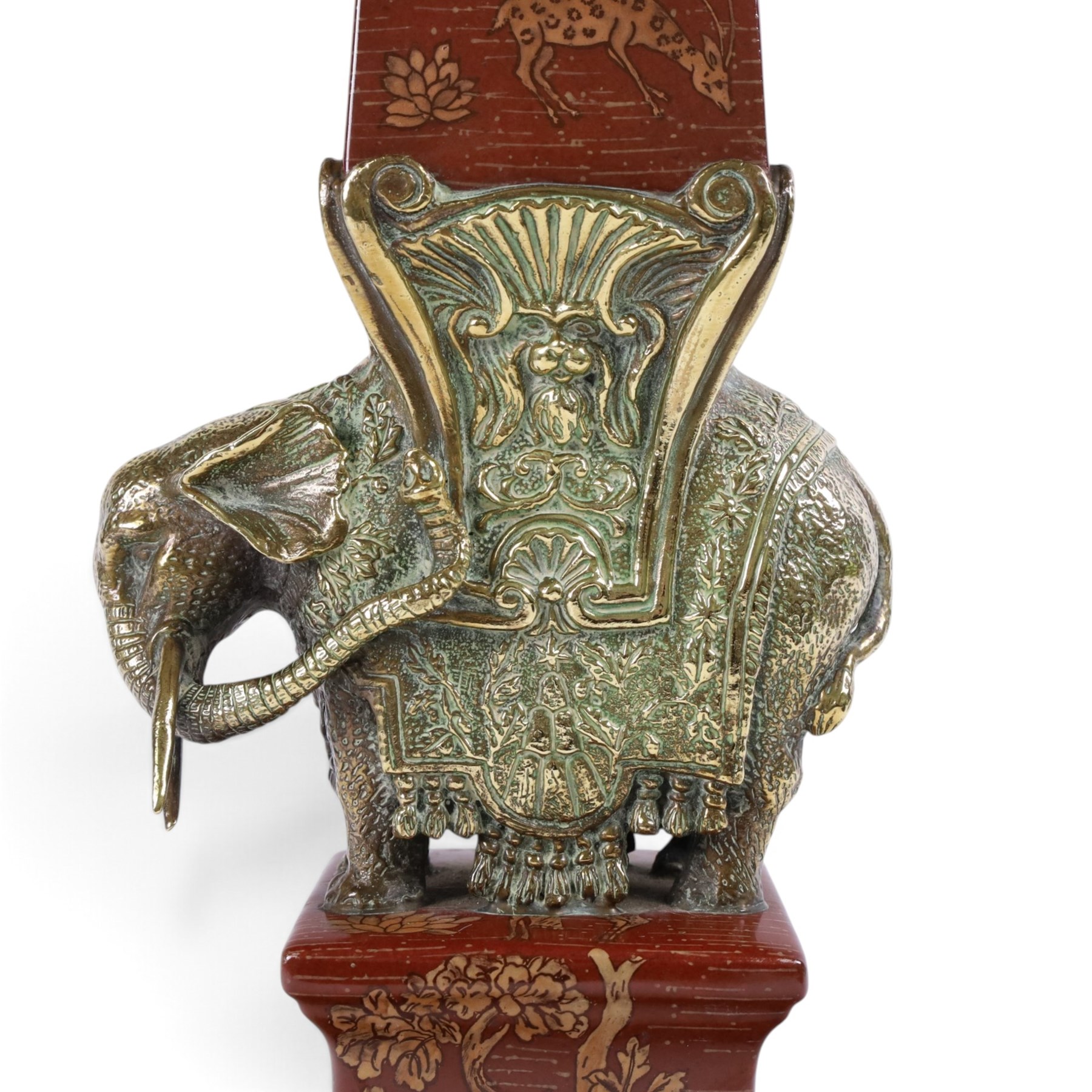 Wong Lee ceramic and brass obelisks, decorated with deer, trees and butterflies mounted on a brass elephant with brass to the base and top, H64cm