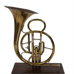 Boosey & Co Ltd French horn, converted into a table lamp, upon a wooden plinth, H45cm
