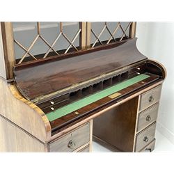 Early to mid-20th century rosewood and mahogany piano top secretaire bookcase, the projecting dentil cornice over two astragal glazed doors, the piano lid enclosing slide out writing surface with baize lining, pigeon holes and drawers, with inscribed brass presentation plaque 