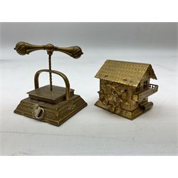 Brass novelty tape measure in the form of a book press, the complete printed tape in cm and inches and wound from the screw, and brass tape measure in the form of a Swiss water mill, the complete printed tape in cm and inches, book press H5cm