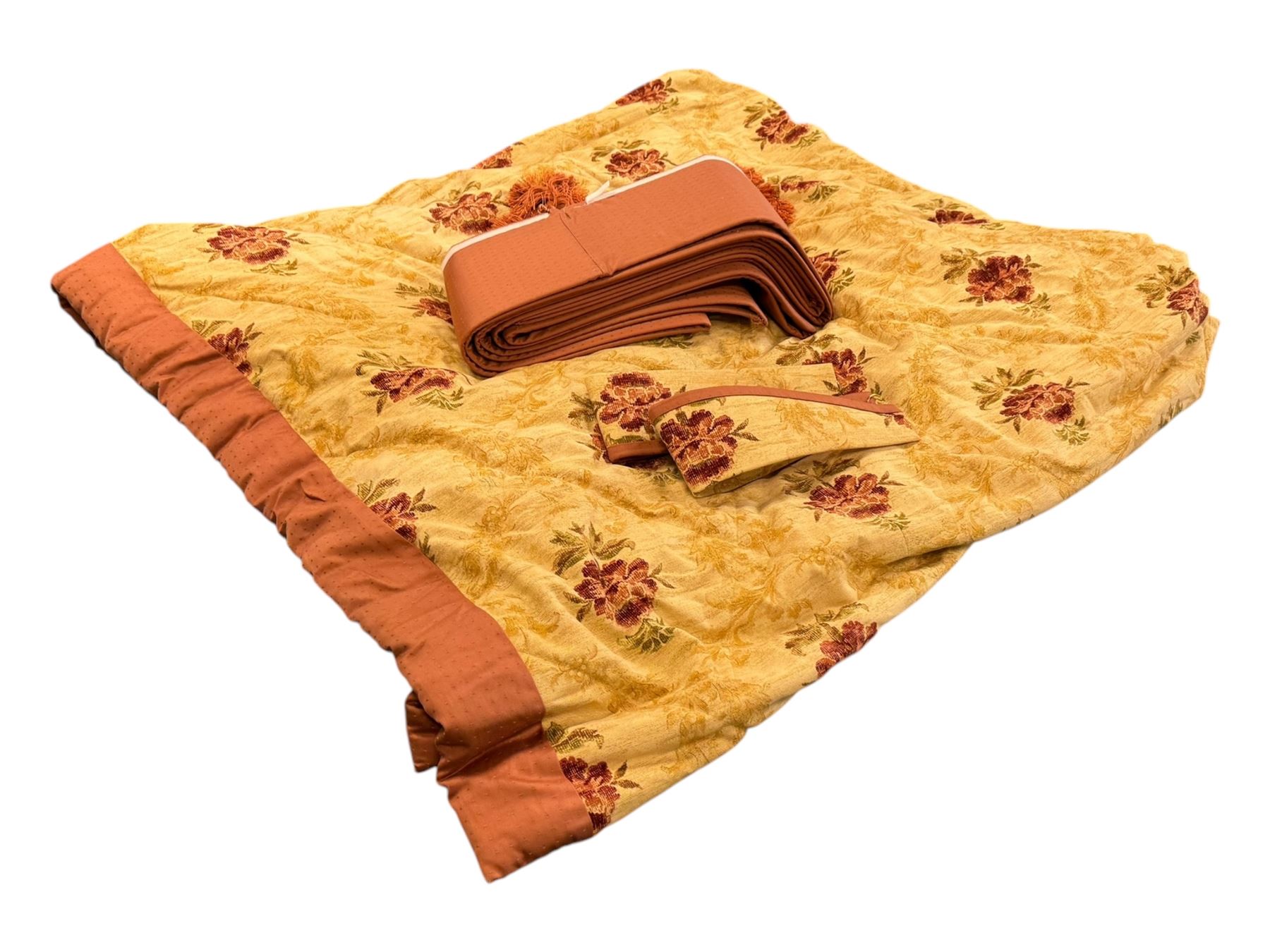 Mid-20th century quilted bedspread and matching valance, the bedspread displaying a warm gold floral pattern with burgundy highlights, complemented by a terracotta fabric trim, together with coordinating terracotta valance with tassels