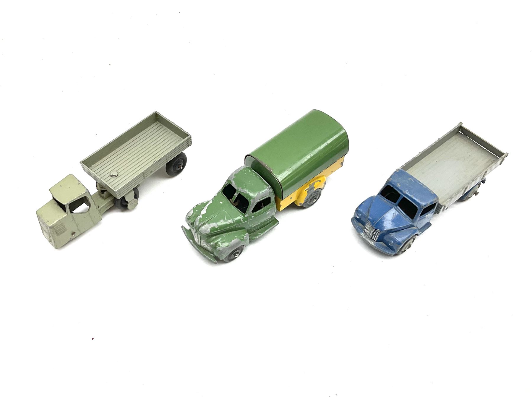 Dinky - six unboxed and playworn early die-cast commercial vehicles including French made Studebaker M16 covered wagon, Trojan Oxo van, B.E.V. Truck, Dodge Tipper, Royal Mail Van etc (6)