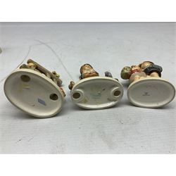 Seven Goebel Hummel figures, comprising Chimney Sweep 12/I, Apple Tree Girl 14/I, Apple Tree Boy,  Little Goat Herder 200/I, Surprise 94 3/0, Signs of Spring 203/20 and Wayside Harmony 111/30, tallest H15cm