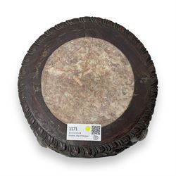 Late 19th century Chinese hardwood pedestal stand, circular top with inset marble panel, carved apron with openwork foliate and floral motifs, raised on cabriole supports with stylised claw and ball feet united by square undertier