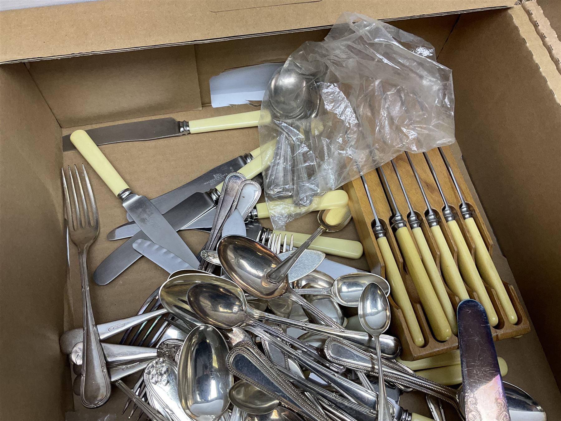 Set of four hallmarked silver teaspoons modelled on spoons from the Roman Imperial period, silver fork, and quantity of silver plated and other cutlery to include Walker & Hall, in two boxes