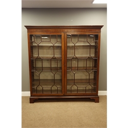  Large Georgian mahogany free standing bookcase, projecting cornice with dentil detail, two astragal glazed doors, eight adjustable shelves, shaped bracket feet, W170cm, H178cm, D44cm  