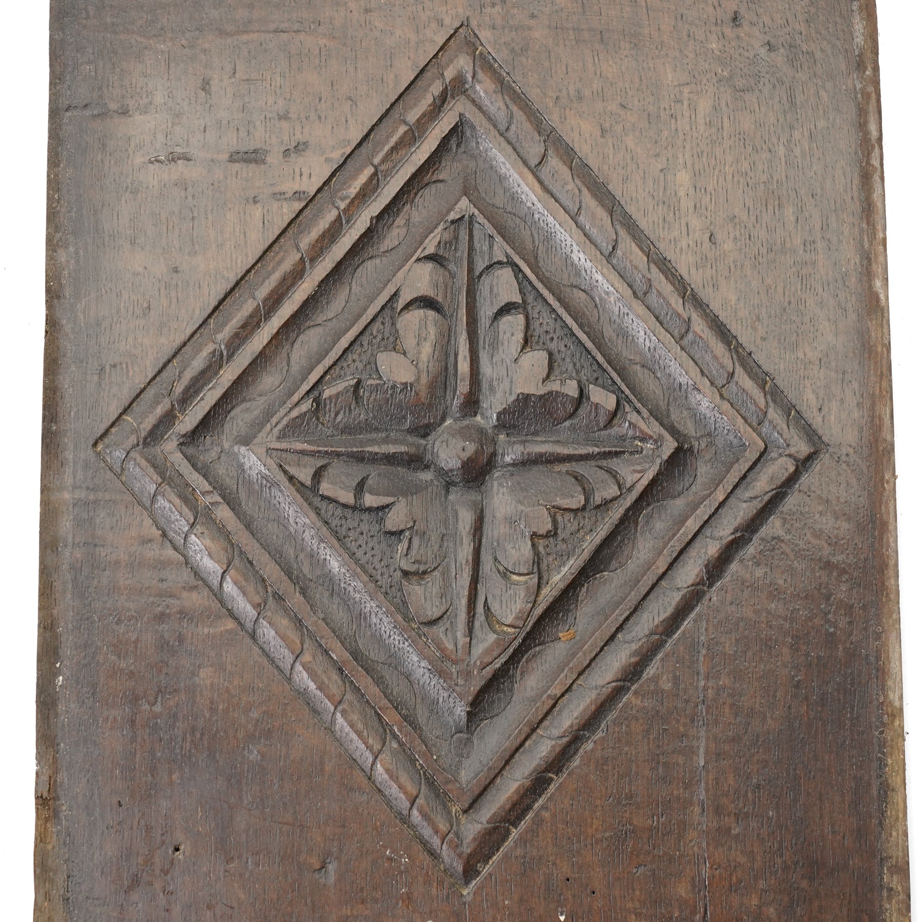Set of four 17th century carved panels with lozenge decoration, and three further carved panels, lozenge panels approx 36.5cm x 24cm, three further 35cm x 10cm 