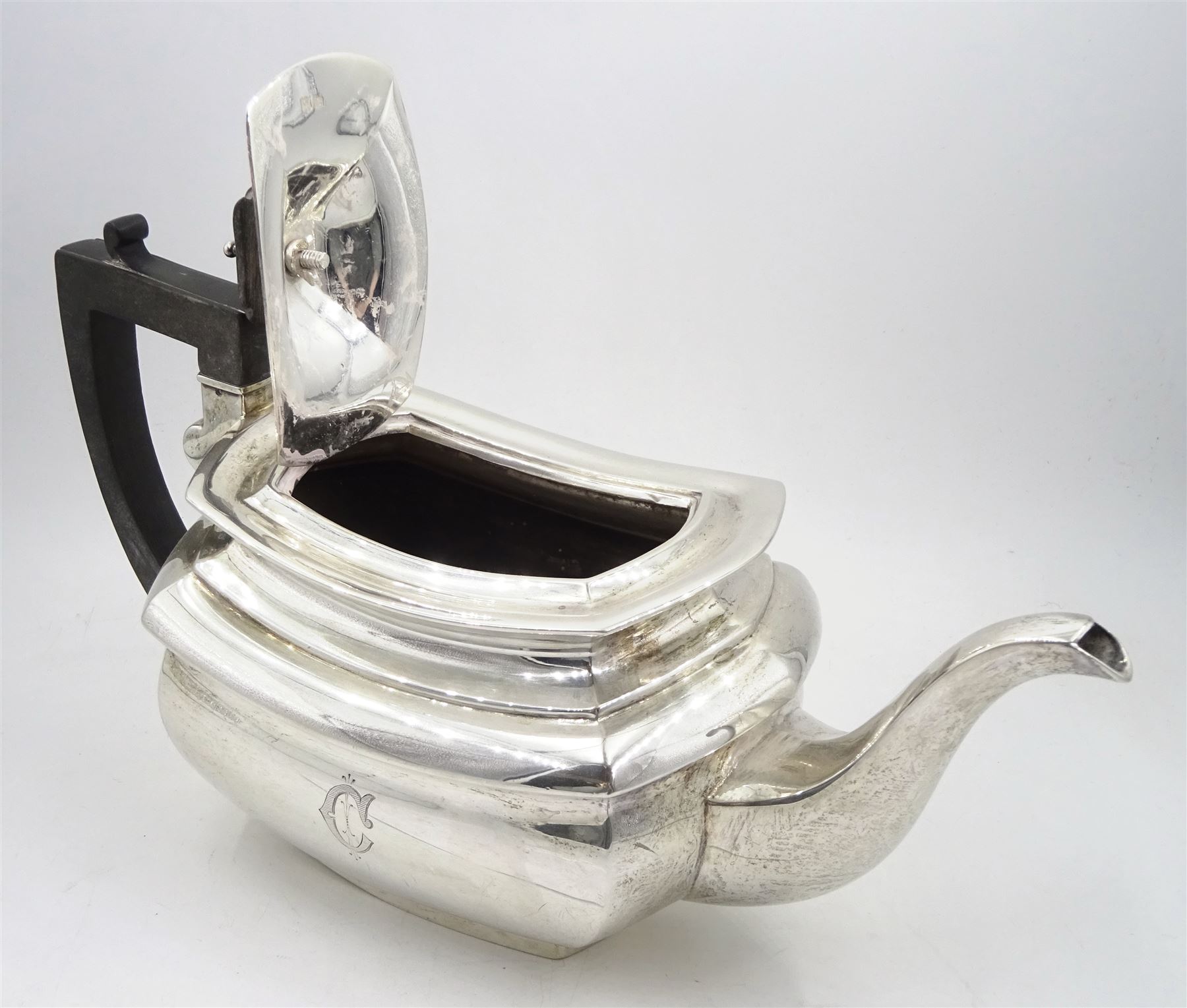 Raich Carter - presentation hallmarked silver two-handled tray of rounded oblong form with gadrooned rim by Wilson & Gill, 139 Regent Street, London, inscribed to the centre 'Presented to Mr. & Mrs. Raich Carter by the Lord Mayor of the City and County of Kingston-upon-Hull Alderman R.E. Smith J.P. on May 30th 1952on behalf of the many Admirers who subscribed to The Lord Mayor's Testimonial Fund in recognition of Raich Carter's genius as a footballer and his services to the City', London 1937 82oz L61cm; together with a hallmarked silver four-piece tea and coffee set by Cooper Bros. & Sons Ltd, the teapot of London shape with ebonised handle and knop, each piece engraved with an initial 'C', Sheffield 1920  60.5oz, teapot L29.5cm