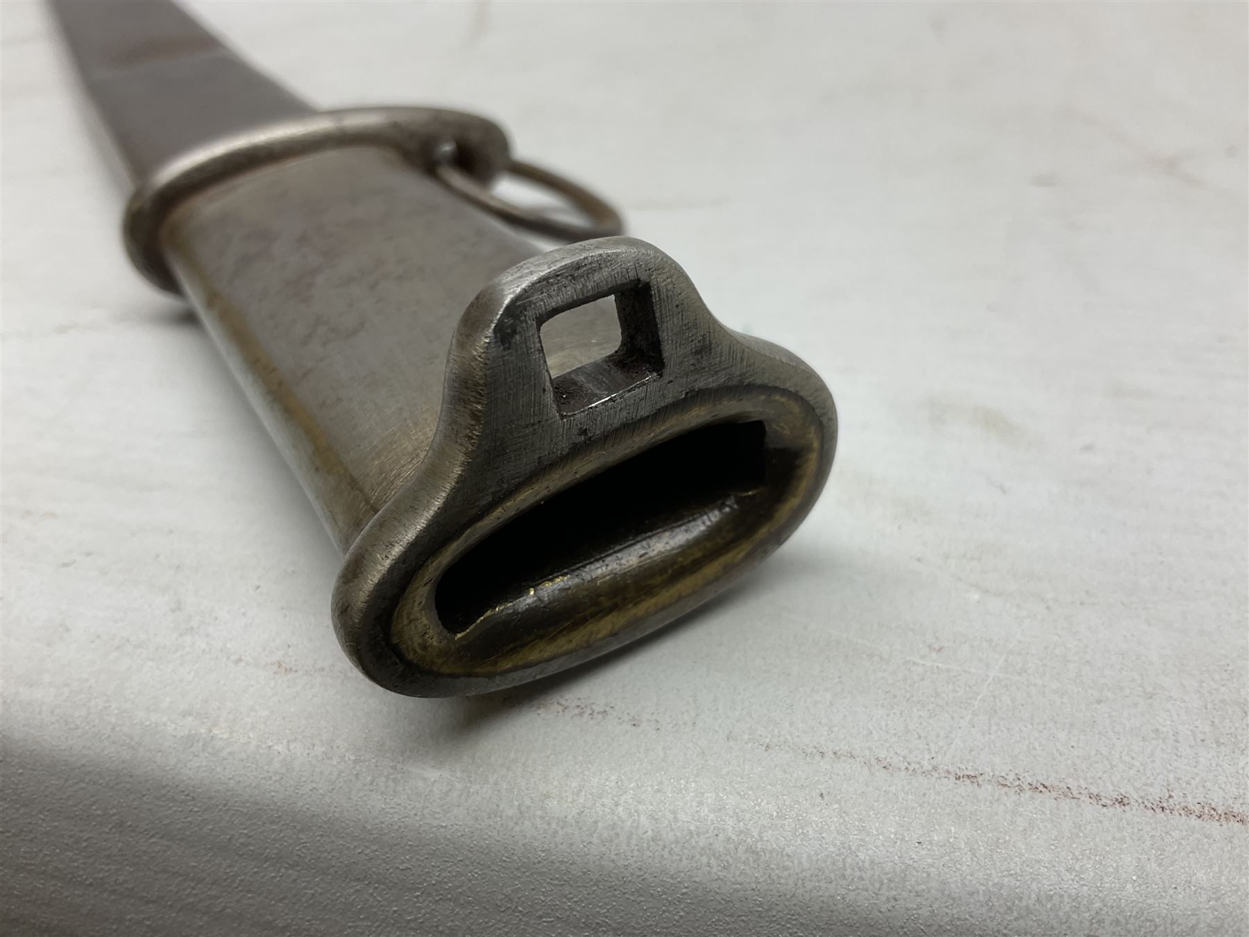 Japanese Model 1899 Type 32 'Otsu' pattern army sword, with 76.5cm single edged, slightly curved blade with narrow fuller, numbered 73684 to the ricasso;  steel hilt with chequered backstrap and grip ears with wooden chequered grip and locking action;  in steel scabbard with single hanging ring L93cm overall