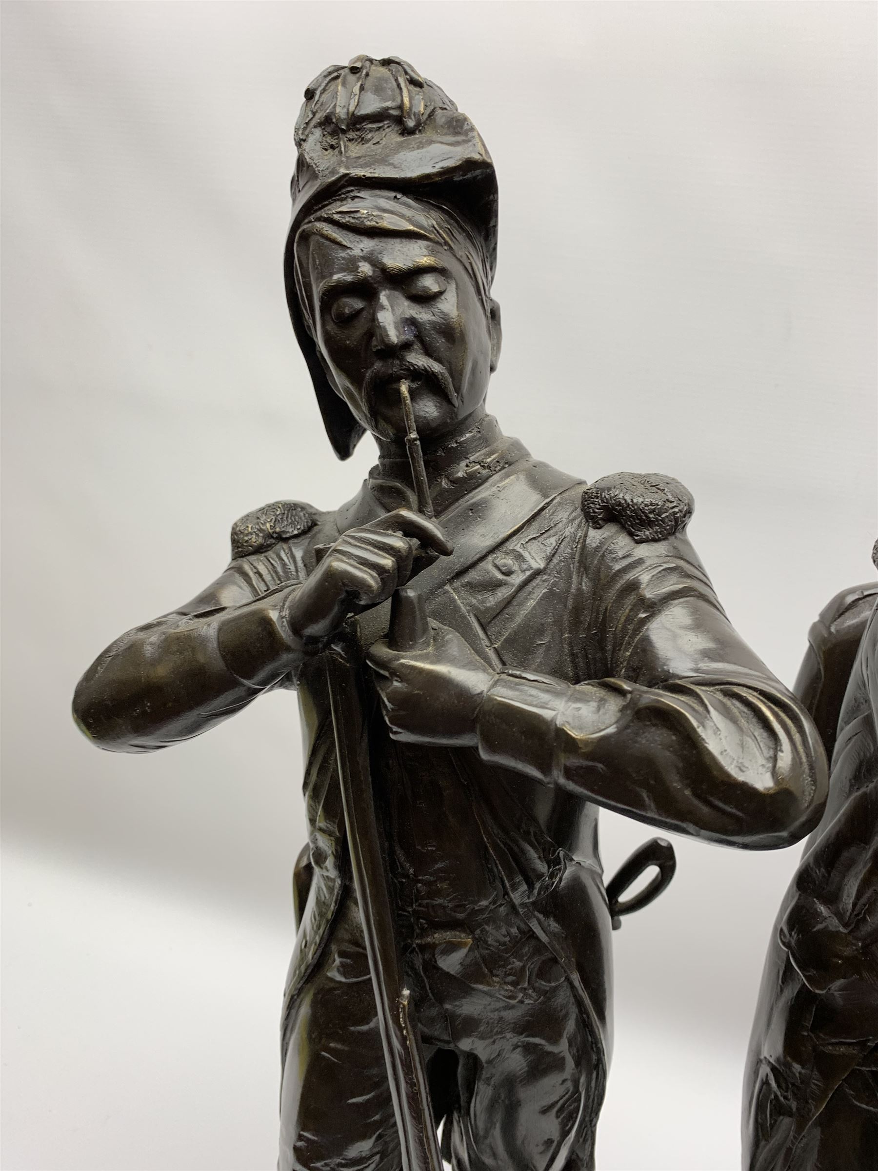 After Etienne-Henri Dumaige (1830-1888): 'Avant de Combat Volontaire de 1792' and 'Apres de Combat Grenaider de 1792', pair of large bronze figures modelled as French Revolutionary soldiers, each upon rectangular stepped black marble base, signed E H Dumaige, Paris 1888, tallest example H68.5cm