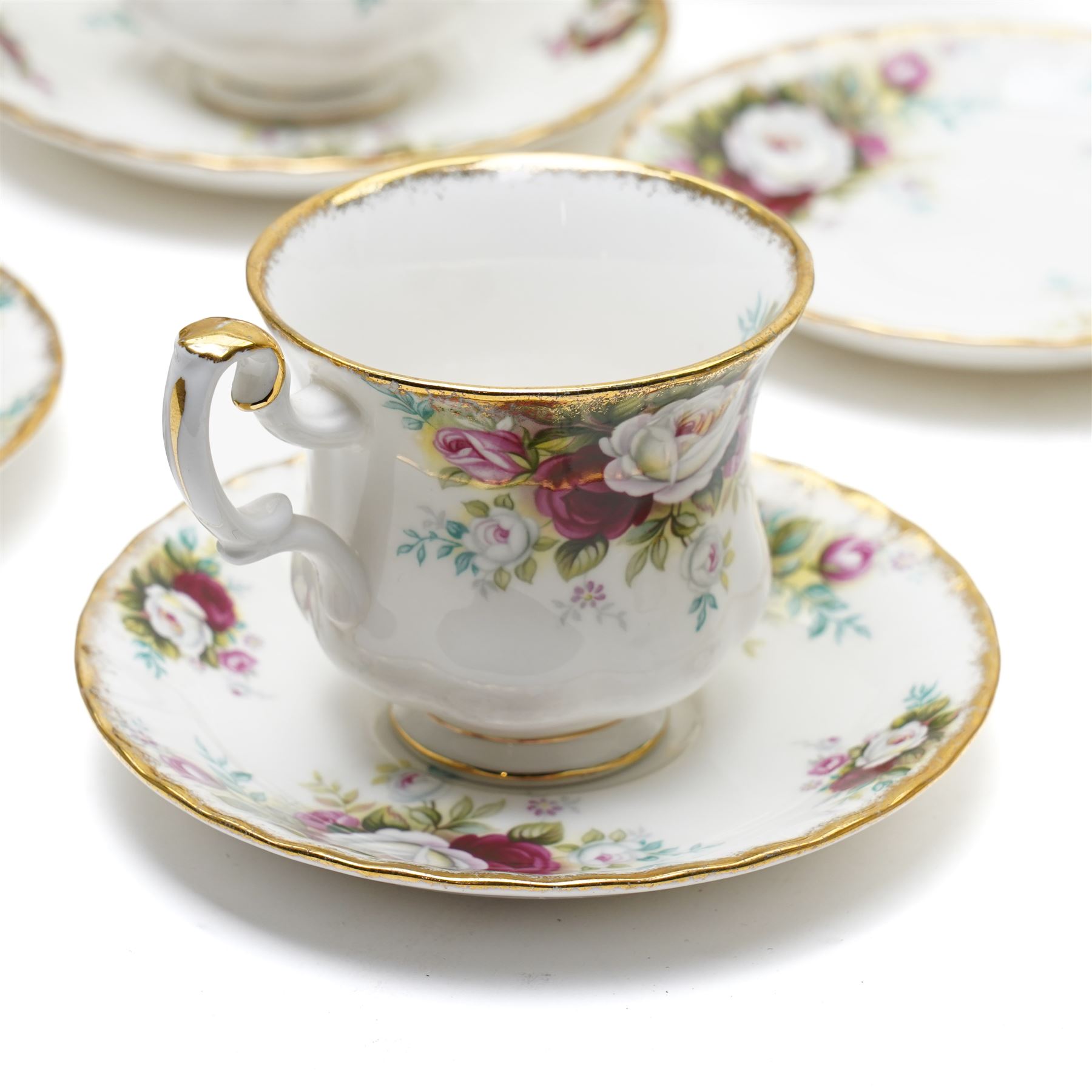 Royal Albert Celebration pattern tea and dinner wares, comprising covered tea and coffee pot, seven dinner plates, oval serving dish, gravy boat and saucer, nine coffee cups and ten coffee cup saucers, seven teacups and eight teacup saucers, eight soup bowls and saucers, rectangular serving tray, ten side plates, etc, approximately 88 pieces in total