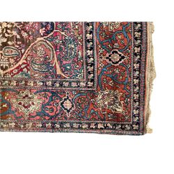 Persian multi-colour ground rug, the central jade medallion surrounded by fushia scrolling, the field decorated with palmettes, botehs and stylised plant motifs, the guarded border with repeating geometric designs