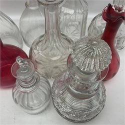 Collection of Victorian and later decanters, to include cut glass and cranberry glass example, and a cranberry glass jug with stopper