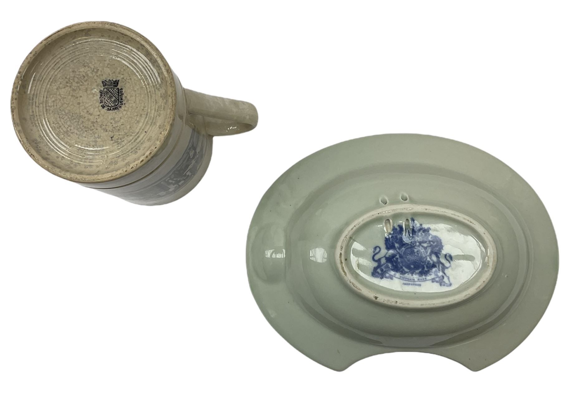 19th century Staffordshire pottery jug, entitled Willie Brewd a Peck o maut, depicting figures in relief, H24cm, a blue and white Victoria Ware Ironstone shaving bowl, L27.5cm, and a 19th century French Sarranguimes tankard with black transfer printed band depicting figures and horses, H17cm
