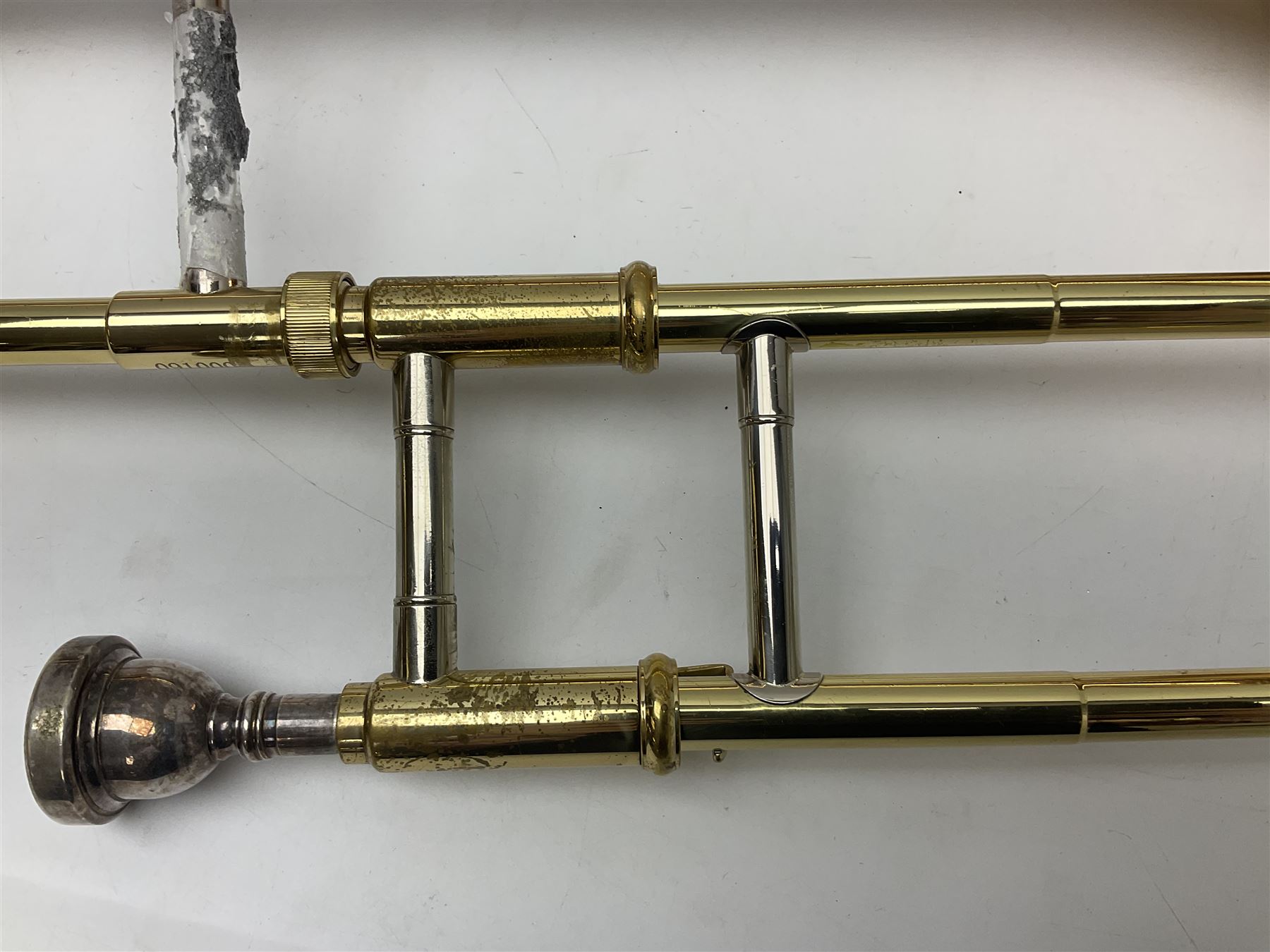 Sebastian Bucklet Aquae Sulis copper and brass trombone No.0910004; in lightweight carrying case; and Kinsman folding tubular chrome music stand in case (2)