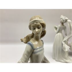 Four Lladro figures, comprising Cinderella no 4828, Reading no 5000, Down the Aisle no 5903 and Off We Go no 5074, largest example H37cm