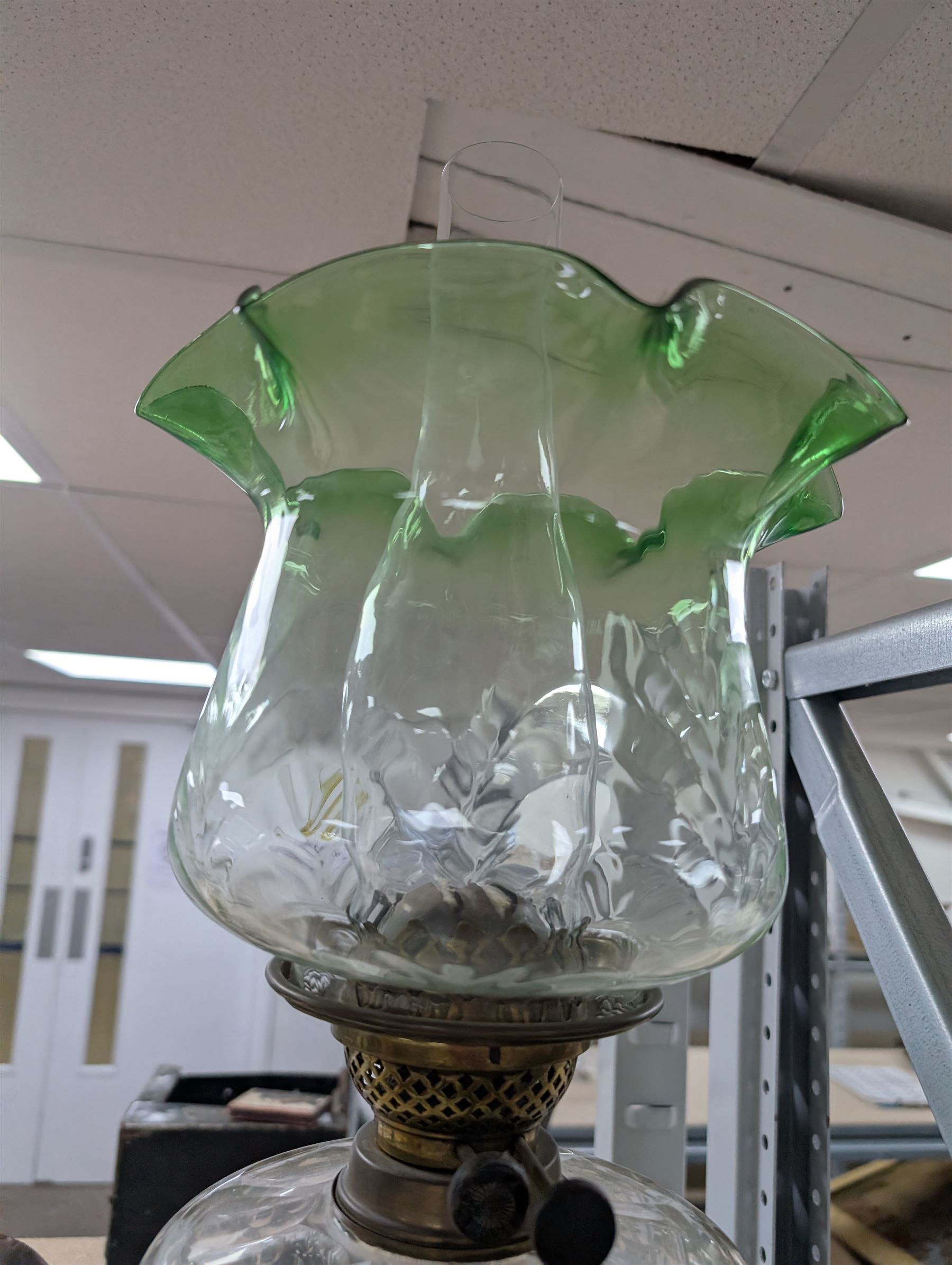 Oil lamp with frilled green glass shade, glass reservoir, upon upon corinthian column with stepped circular base, H74cm