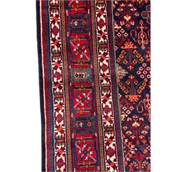 Persian Meimeh indigo ground rug, the central medallion within a field of small floral lozenge motifs, the guarded border with repeating pattern