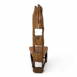 20th century driftwood sculptural hall chair, solid triangular seat over shaped apron, high ladder back formed from weathered and irregular timber, raised on curved legs united by H-stretcher