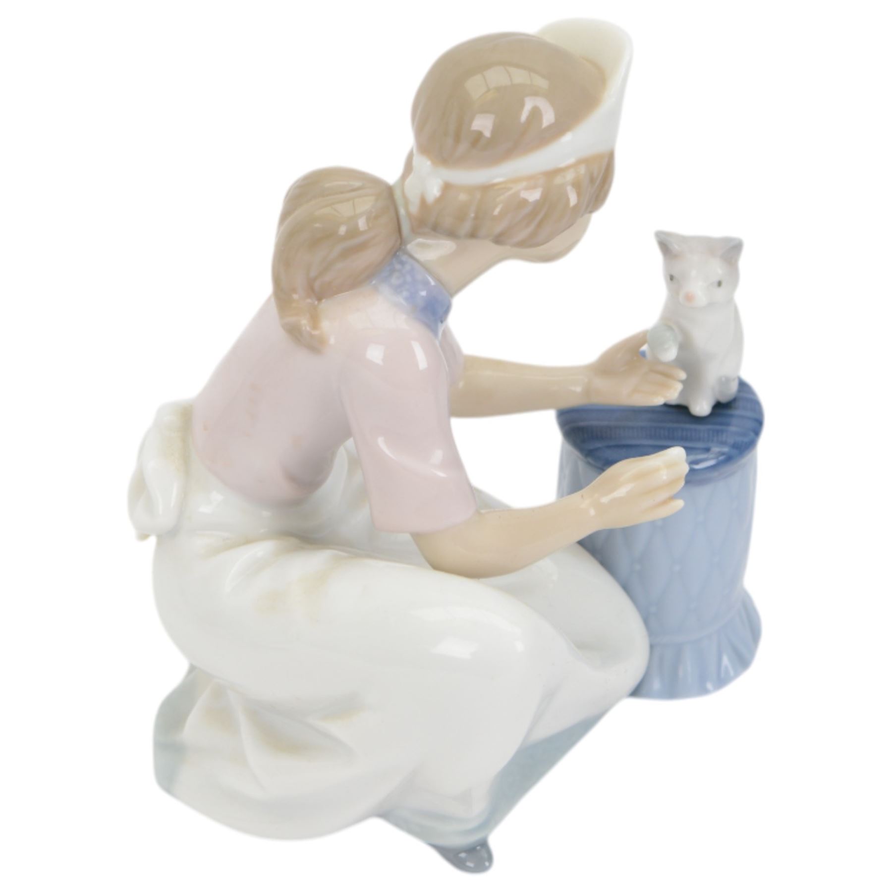 Four Lladro figures, comprising Loving Care no 6087, Young Nurse no 6307, Girl with Chicken no 4592 and Female Physician no 5197, three with original boxes 